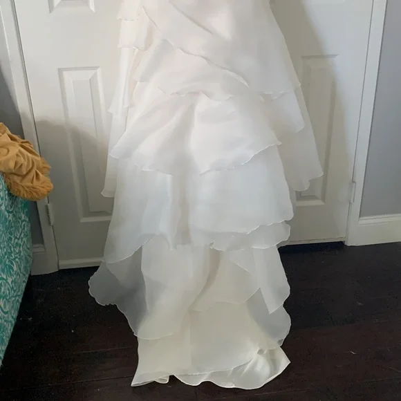 Beautiful off white Demtria cascading wedding dress.  Size 10, but altered. - Picture 8 of 12